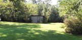 back yard with storage building